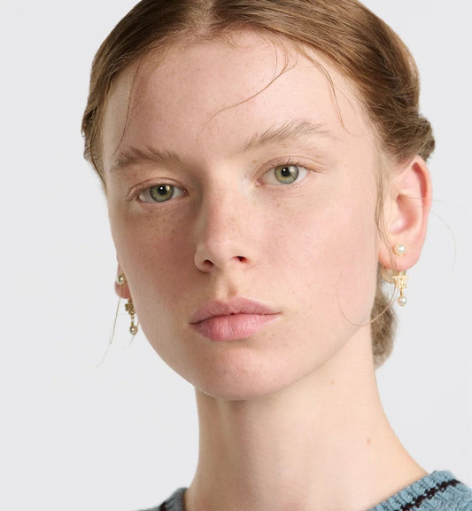 wearing Dior Tribales Asymmetric Star Earrings E3715WOMCY_D03S