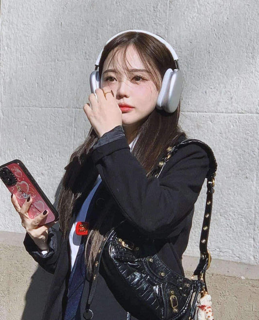 wearing BALENCIAGA LE CAGOLE XS BLACK SHOULDER BAG WITH GOLD HARDWARE 671309210F61000