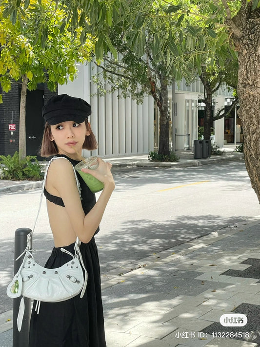 wearing BALENCIAGA LE CAGOLE XS SHOULDER BAG IN PATENT WHITE Authentic