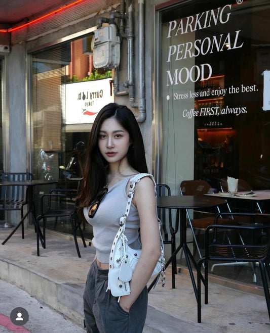 wearing BALENCIAGA LE CAGOLE XS WHITE SHOULDER BAG FW23 6713091VG9Y9104