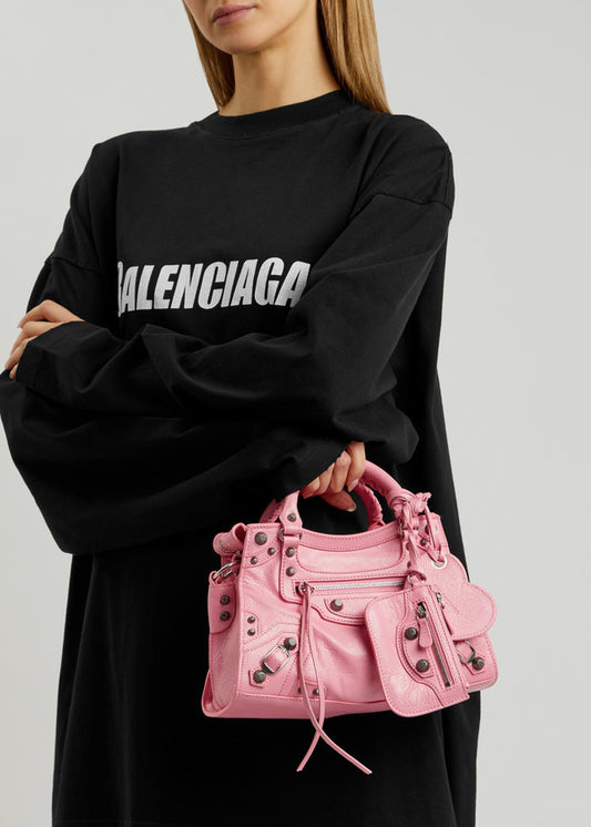 wearing BALENCIAGA NEO CAGOLE XS SHOULDER BAG SWEET PINK 23FW 7515211VG9Y5812