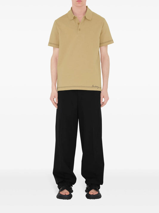 wearing Burberry Embroidered Hem Polo Shirt In Beige 8090489