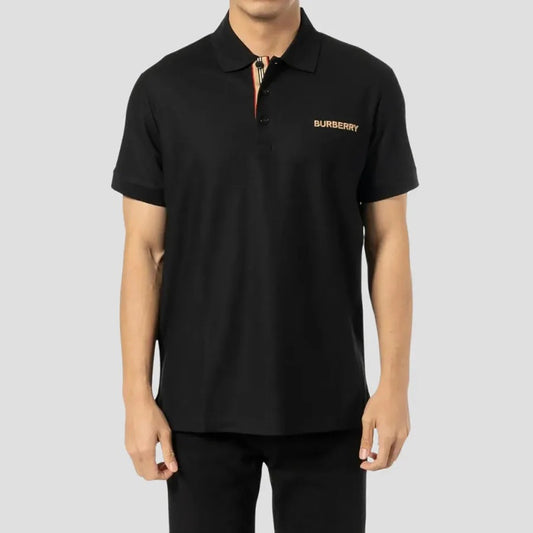 wearing Burberry Hartford Logo Embroidered Polo Shirt In Black 8084436
