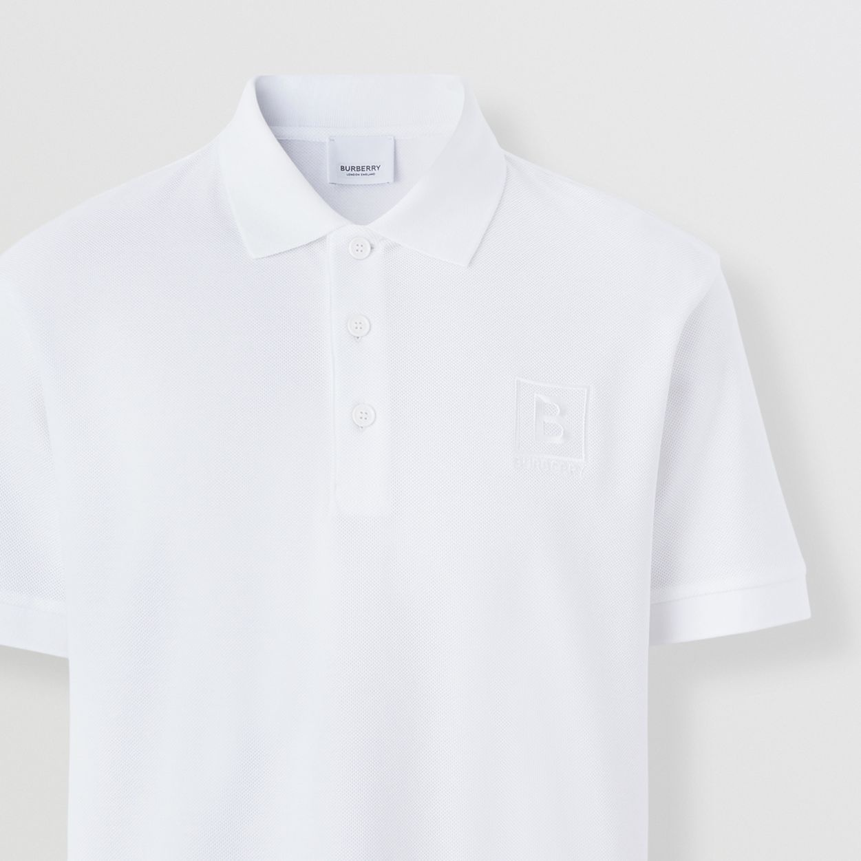 BURBERRY LETTER GRAPHIC LOGO-EMBOIRDERED POLO IN WHITE 8053026