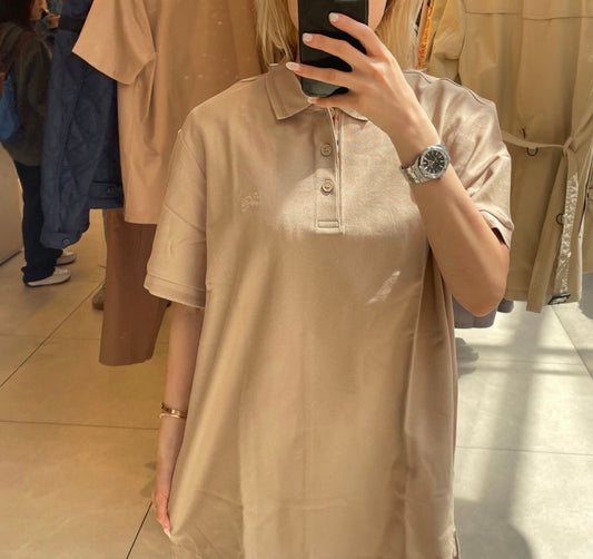 wearing BURBERRY LOGO-EMBOIRDERED EQUESTRIAN KNIGHT POLO IN BEIGE 8078092