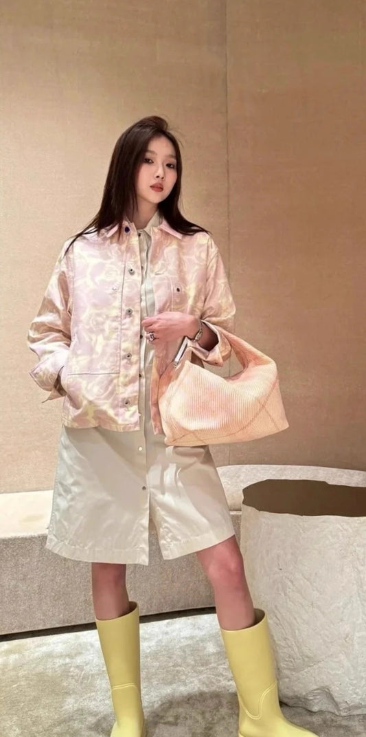 wearing BURBERRY MEDIUM PEG DUFFLE BAG IN SHERBET 80820461