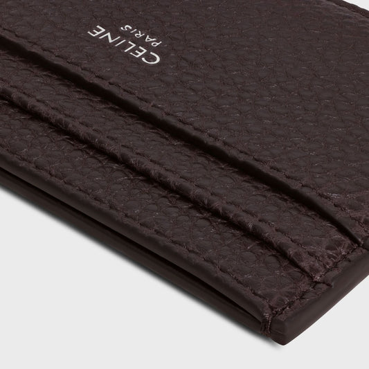 Close-up of a Celine Card Holder in Grained Calfskin Espresso 10N763GTH.19ES with 'CELINE PARIS' branding on a light gray background.