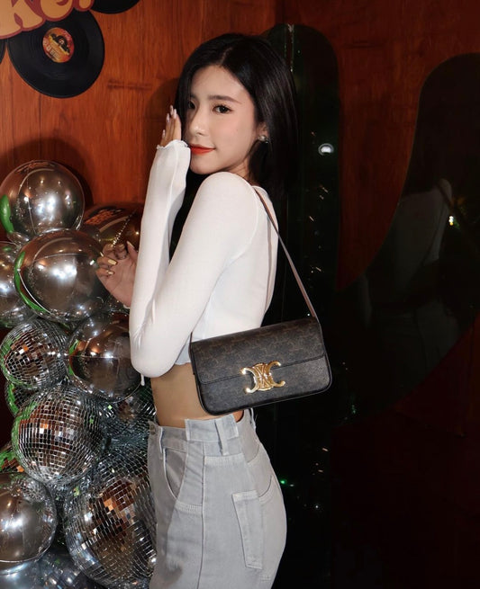 wearing CELINE SHOULDER BAG CLAUDE IN TRIOMPHE CANVAS AND CALFSKIN TAN 194142CUZ.04LU