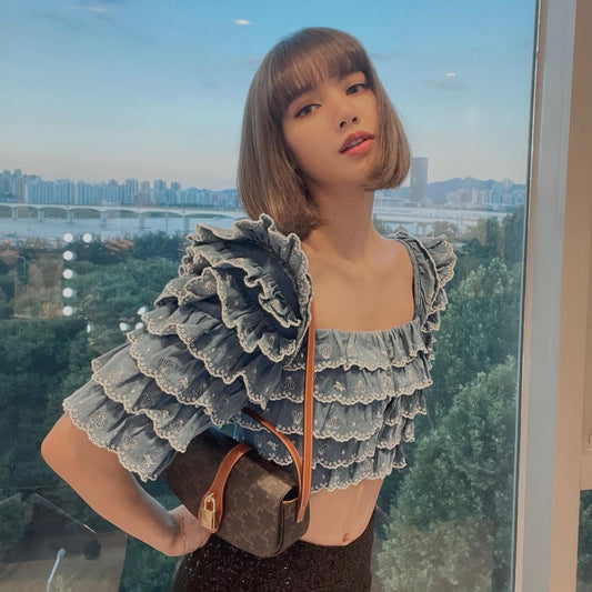 Lisa wearing CELINE TAN CLUTCH ON STRAP TABOU IN TRIOMPHE CANVAS AND CALFSKIN 10I592DQ2 04LU