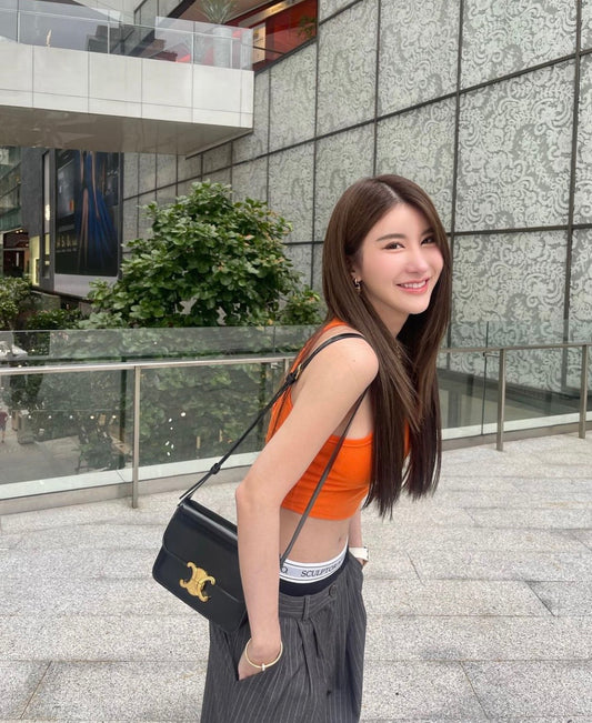 wearing CELINE TEEN TRIOMPHE BAG IN SHINY CALFSKIN BLACK 188423BF4.38NO