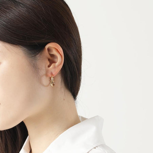 wearing CELINE TRIOMPHE ASYMMETRIC HOOPS IN BRASS WITH GOLD 460RD6BRA.35OR