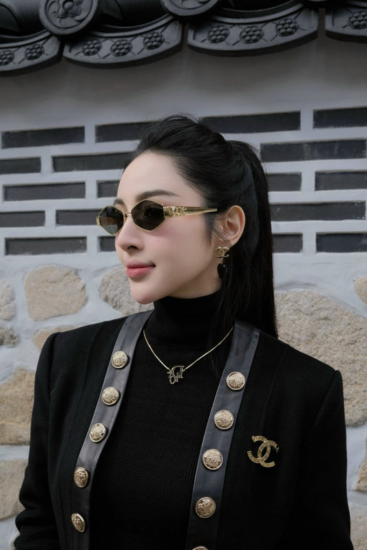 wearing CELINE TRIOMPHE METAL 02 SUNGLASSES IN METAL GOLD 4S254CMLB.35SG