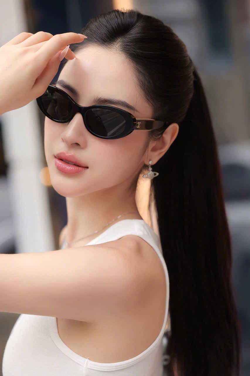 Woman wearing Chanel CH5515 C62248 Sunglasses with a blurred background