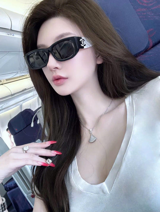 wearing CHANEL CH5525 1656T8 BLACK WHITE SUNGLASSES