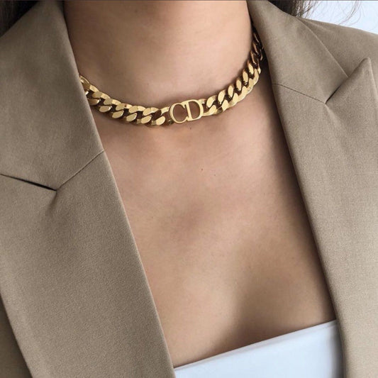 Dior Danseuse Étoile Choker Necklace N0519DSEMT_D300 worn by a person in a beige blazer.