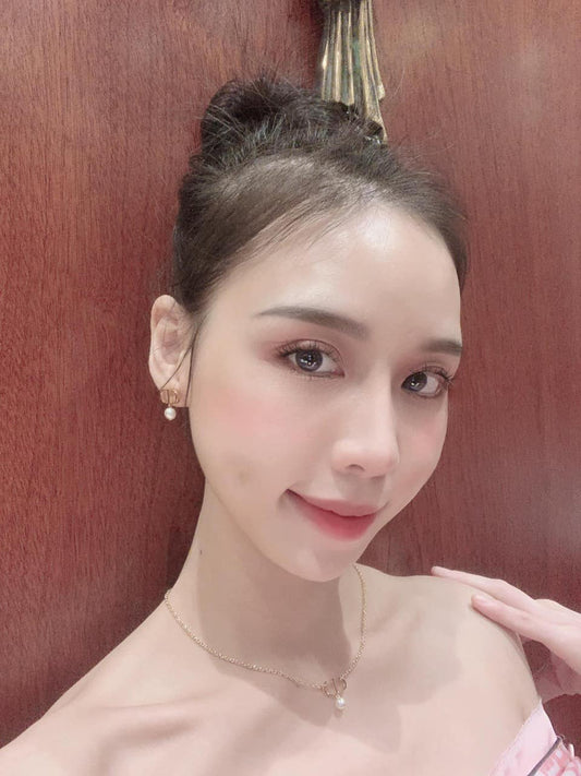 wearing DIOR PETIT CD EARRINGS GOLD & WHITE E1520PTCRS_D301