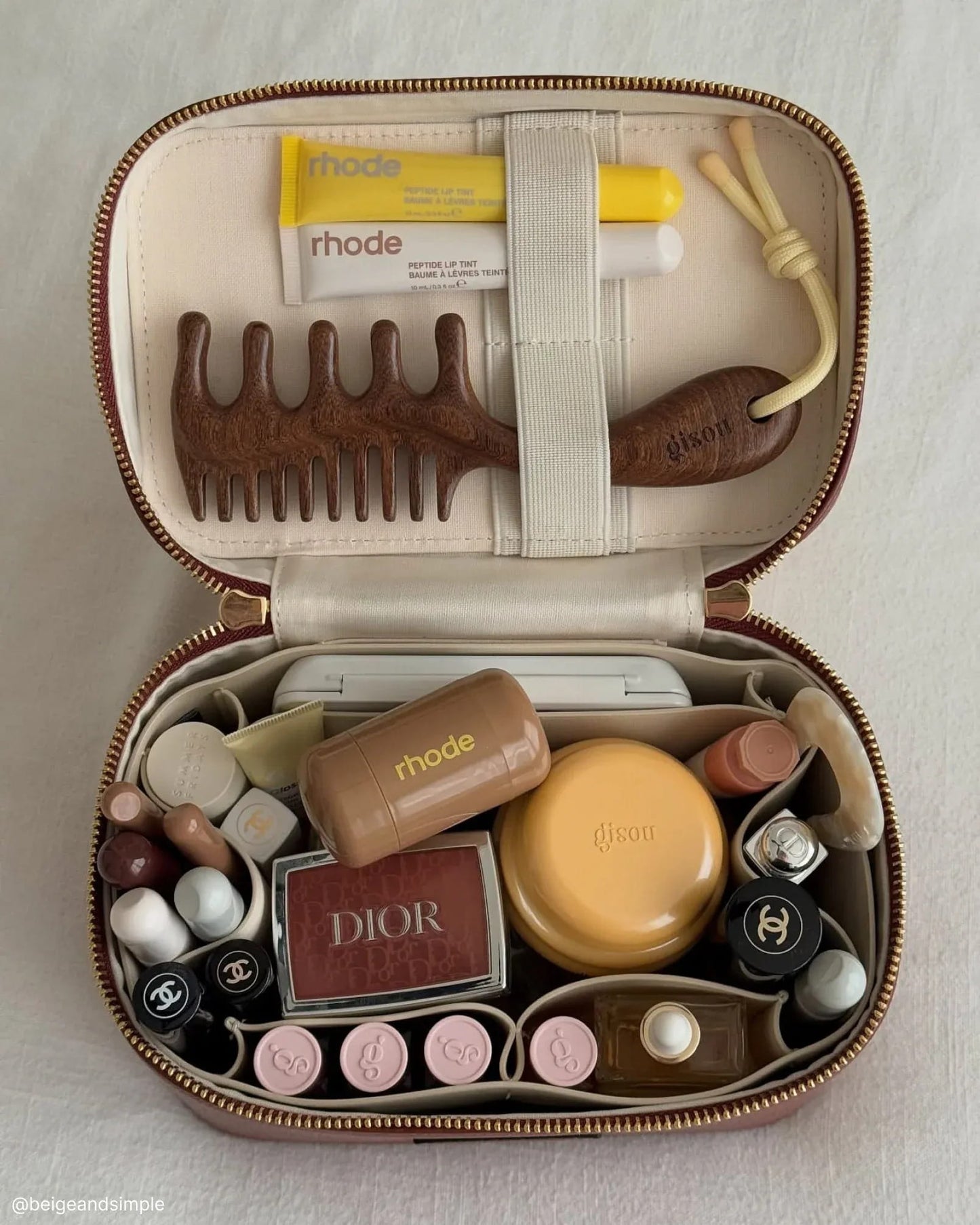 Open Etoile Mini Vanity Case Espresso with various items including a comb, hair products, and lipsticks.