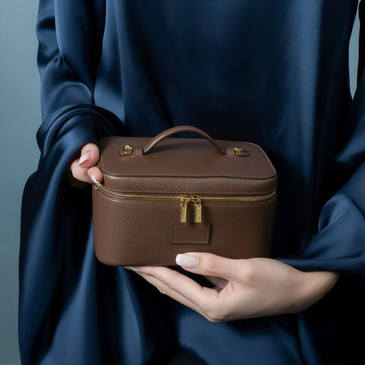 Etoile Vanity Case Espresso held by a person wearing a blue garment