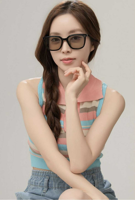 Woman wearing GENTLE MONSTER BY ROW 01(BR) with a neutral background