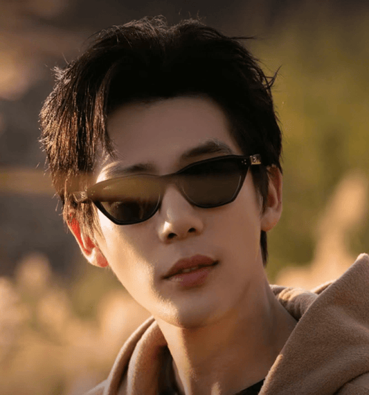 Person wearing Gentle Monster Gisele 01 with a blurred natural background