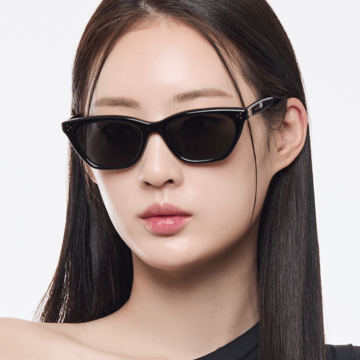 Woman wearing Gentle Monster Gisele 01 with a plain background
