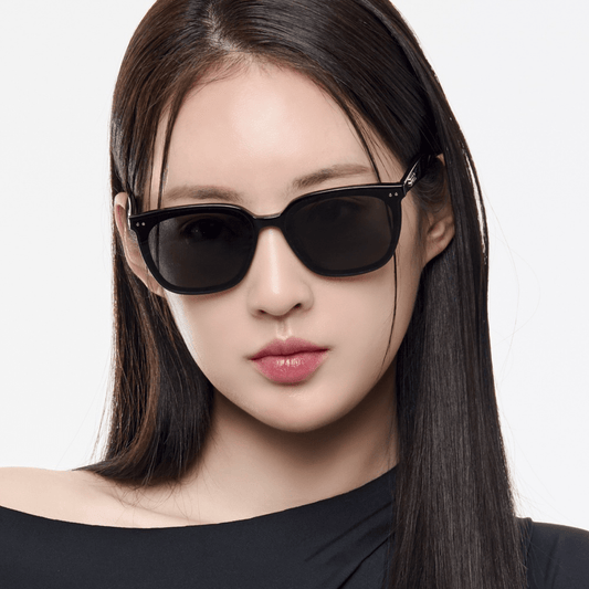 Woman wearing Gentle Monster (GM) Heizer 01 against a white background