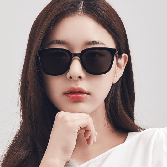 Woman wearing Gentle Monster (GM) Lilit 01 with a neutral background