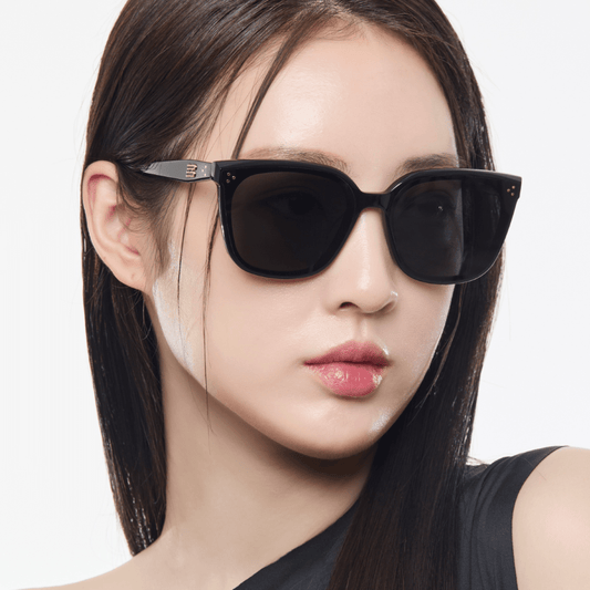 Woman wearing Gentle Monster (GM) Loloe 01 with a neutral background