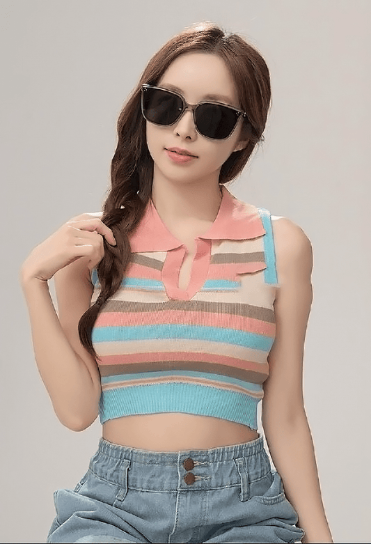 Woman wearing a colorful striped sleeveless top with Gentle Monster (GM) Loloe BRC17 and denim pants against a plain background