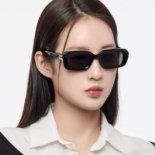 Woman wearing Gentle Monster (GM) Melrose 01 with a plain background