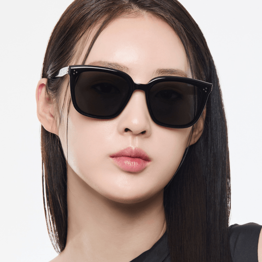 Woman wearing Gentle Monster (GM) My Me 01 on a white background