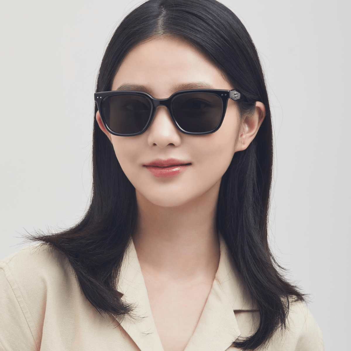Woman wearing Gentle Monster (GM) Nubo 01 against a plain background