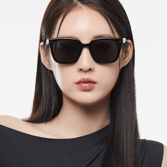 Woman wearing Gentle Monster (GM) Palette 01 with a plain background