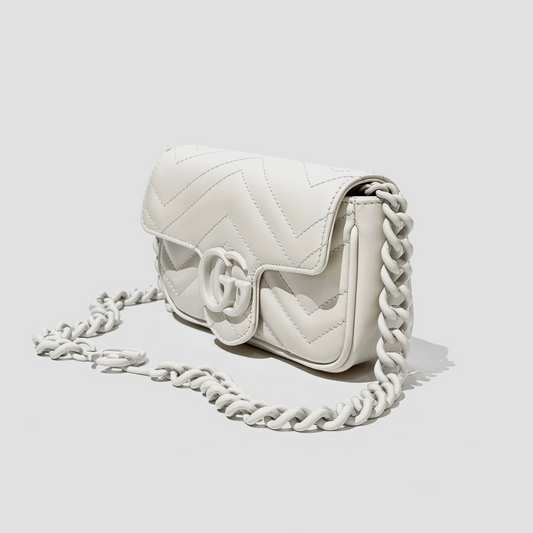 GUCCI MARMONT BELT BAG WHITE 699757 UM8KV 9022 with braided chain strap on a light gray background