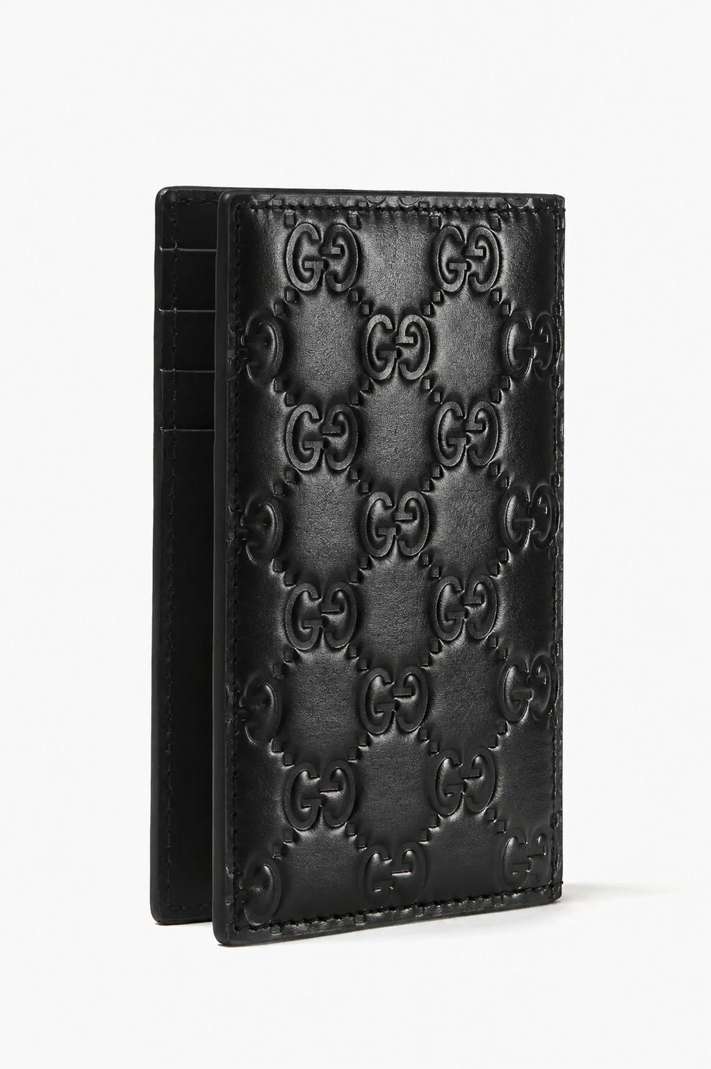 A Gucci GG Black Rubber-Effect Long Card Case 771317 AAC0L 1000 featuring the embossed Gucci GG monogram pattern, shown standing upright against a plain white background.