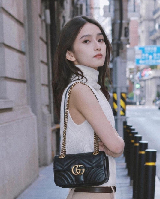wearing GUCCI GG MARMONT MATELASSÉ MINI BAG IN BLACK 446744 DTDIT 1000
