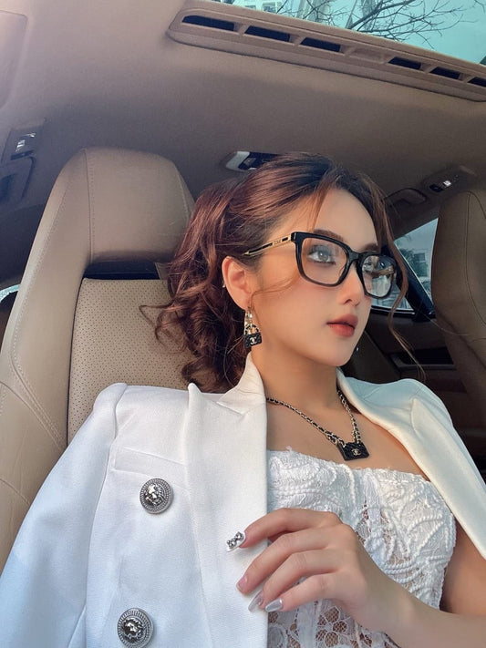 wearing GUCCI GG0560ON 005 BLACK CRYSTAL GOLD EYEGLASSES