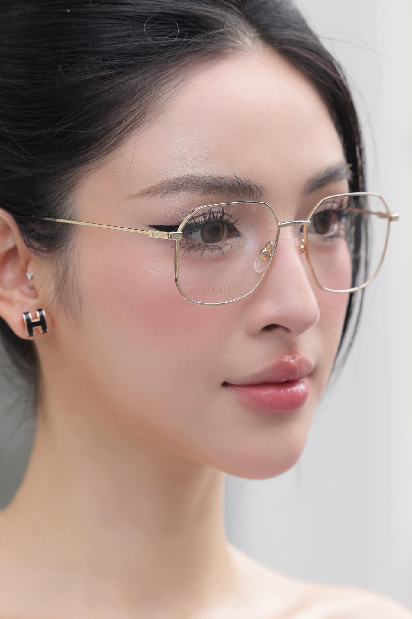 wearing GUCCI GG1032O 006 SILVER EYEGLASSES