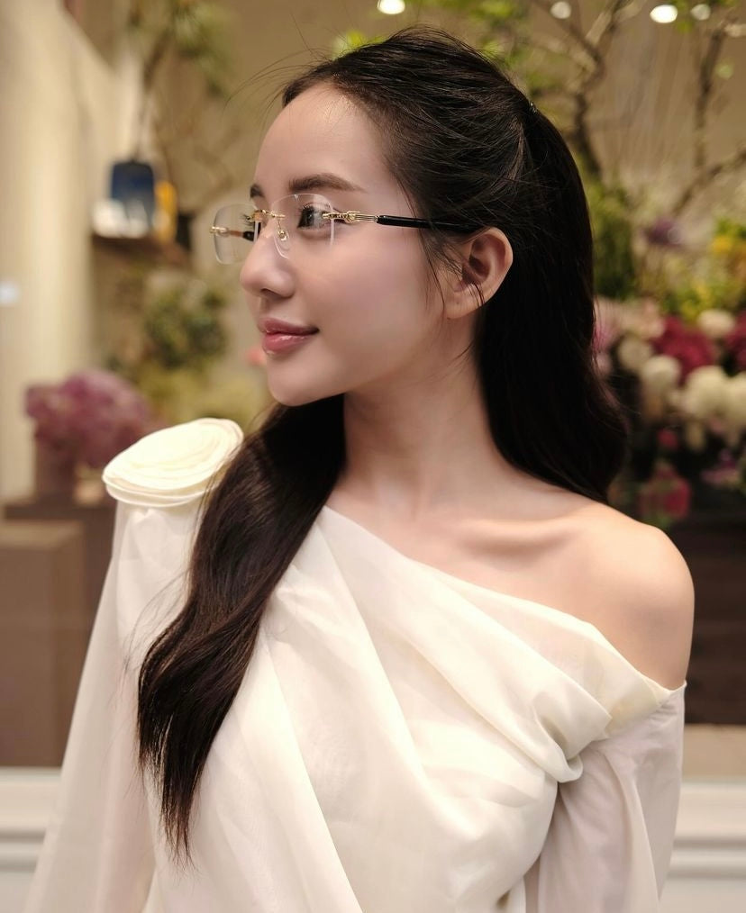 wearing GUCCI GG1221O 001 BLACK GOLD RIMLESS EYEGLASSES