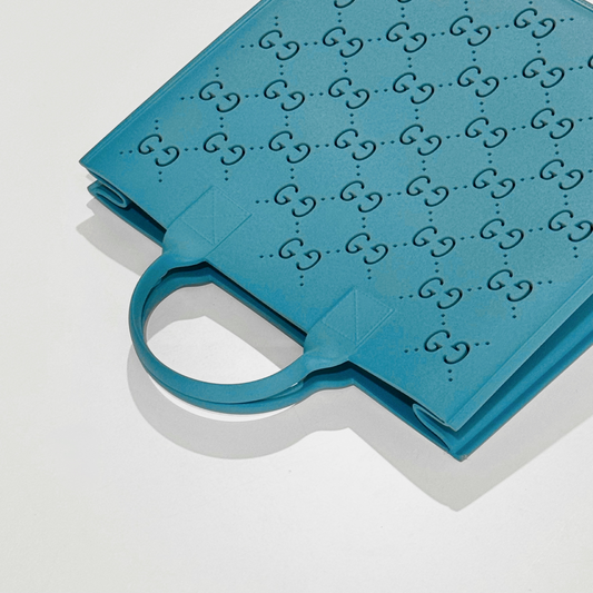 Gucci Kids GG Rubber Shopper Bag Light Blue 679365 JFO00 4933 with a pattern on a white background