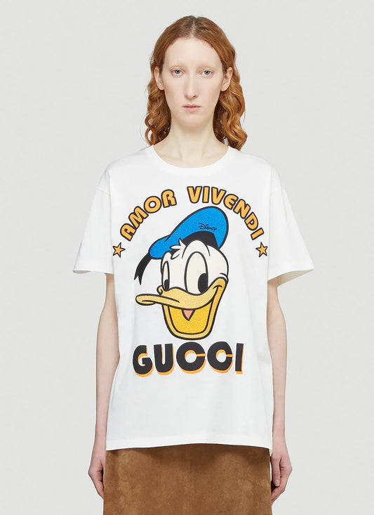 wearing GUCCI X DISNEY DONALD DUCK AMOR VIVENDI IVORY JERSEY T-SHIRT 615044 XJDBJ 9088