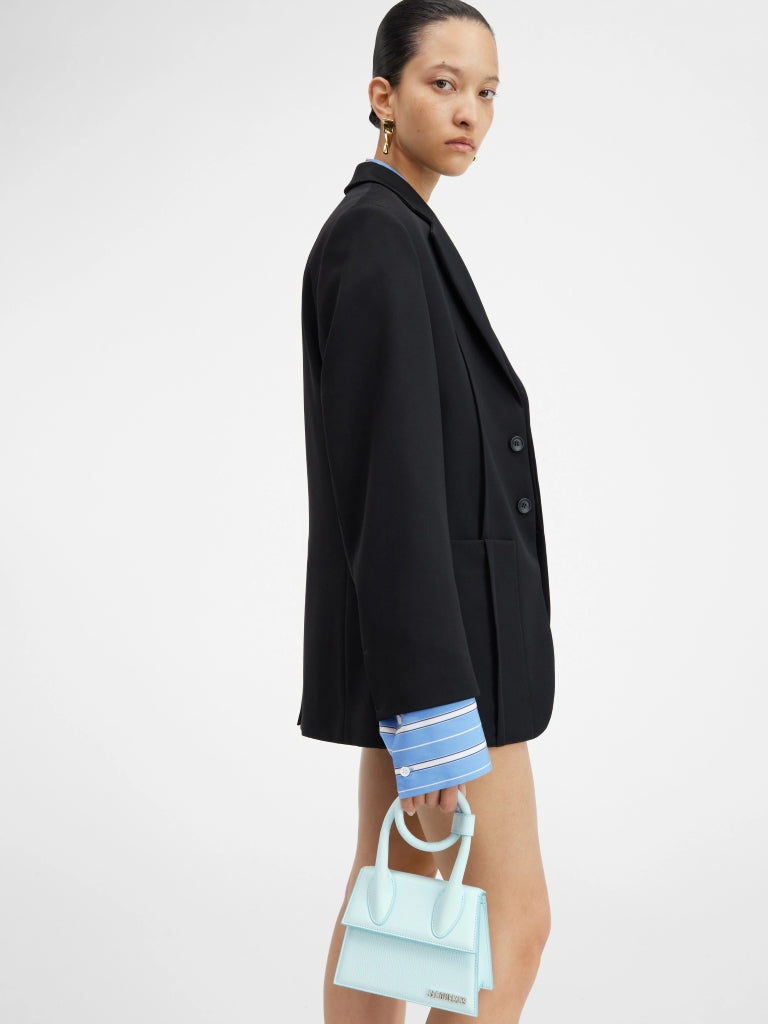 wearing JACQUEMUS LE CHIQUITO NOEUD LIGHT BLUE 213BA005-3102-320