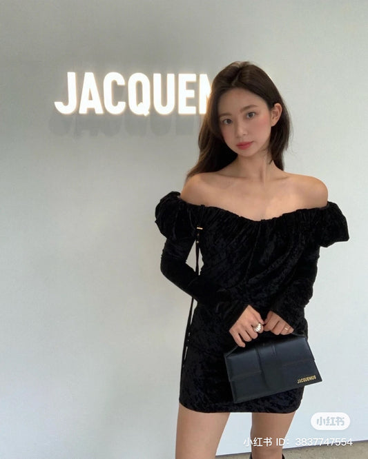 wearing JACQUEMUS LE GRAND BAMBINO BLACK/GOLD 213BA007-3000-100