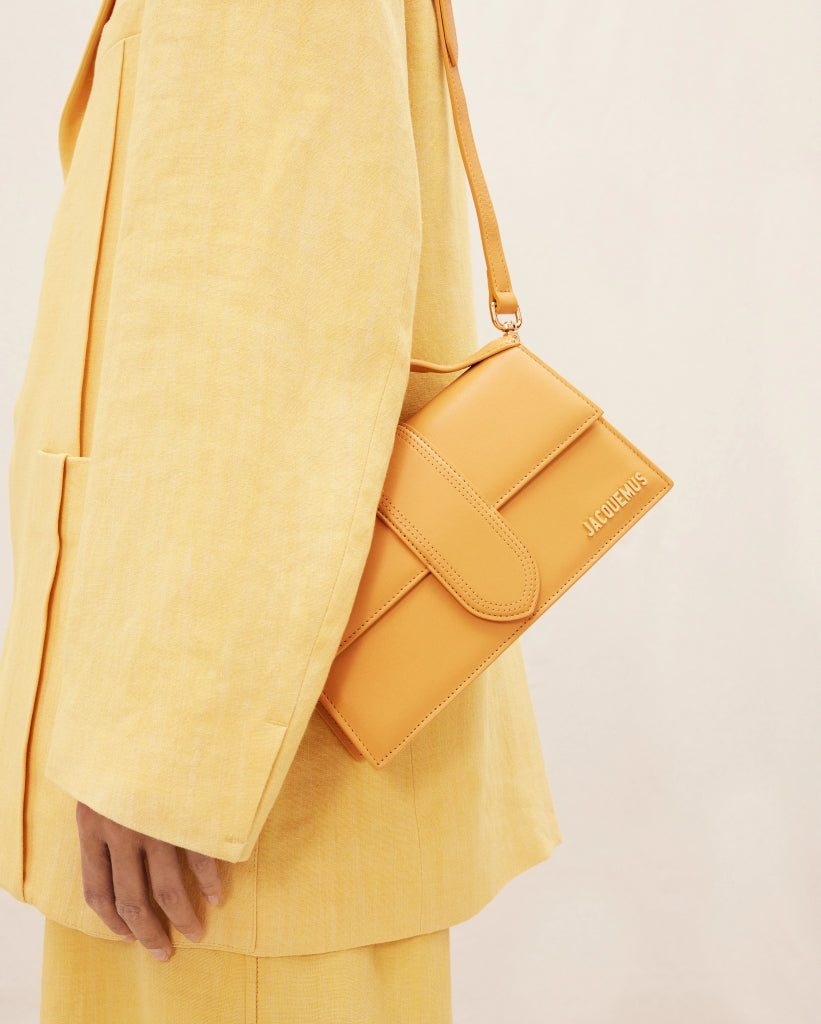 wearing JACQUEMUS LE GRAND BAMBINO DARK YELLOW 213BA007-3060-290