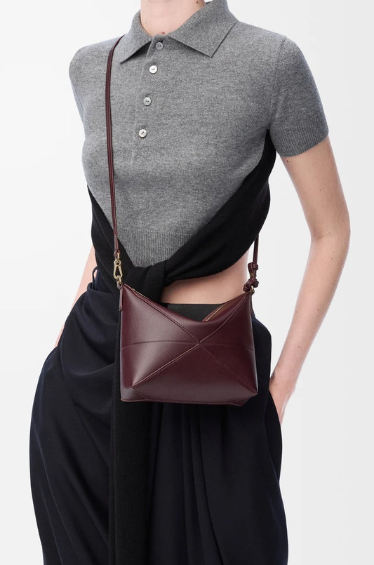 wearing Loewe Puzzle Fold Pouch in Shiny Nappa Calfskin – Dark Burgundy C510PT1X01-7240