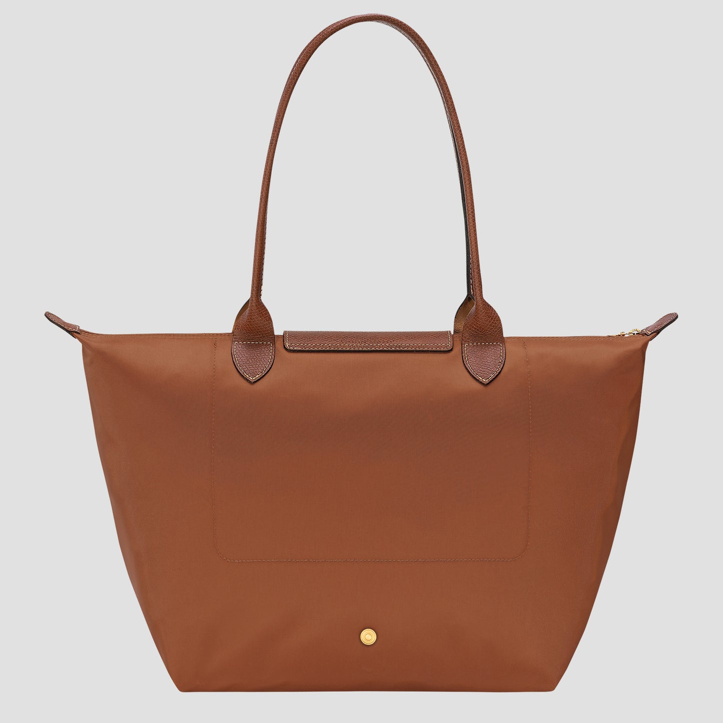 Longchamp Le Pliage Original L Tote Bag – Cognac L1899089504 with leather handles on a light gray background
