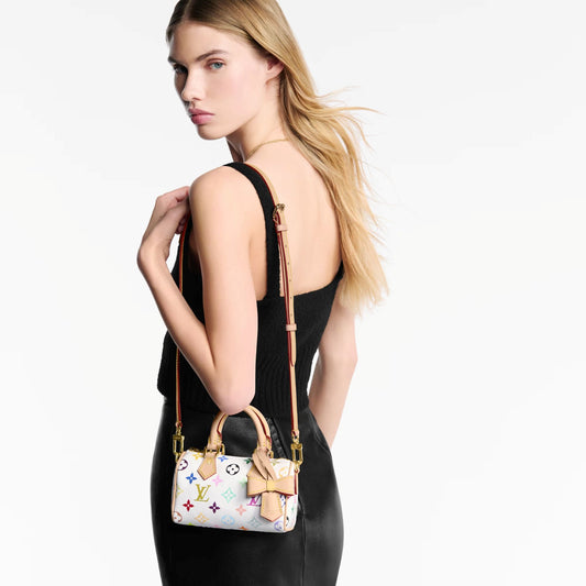 women hanging Louis Vuitton x Takashi Murakami Nano Speedy Multicolor Blanc M13391 with black top and skirt