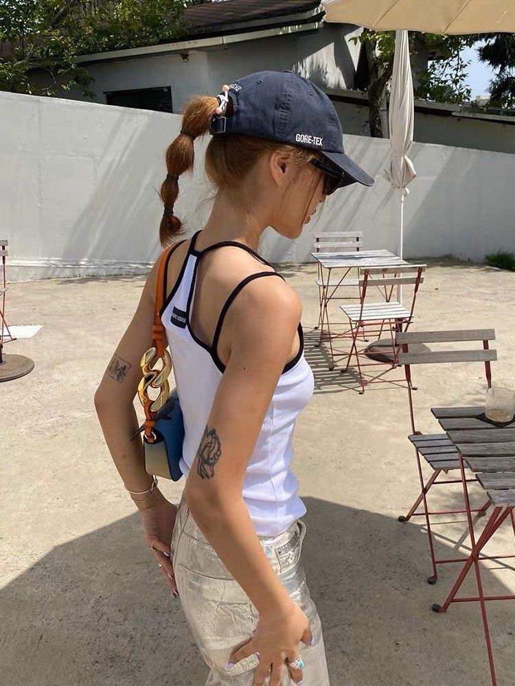 wearing MARINE SERRE TENNIS COURT TOP WHITE T353SS23W