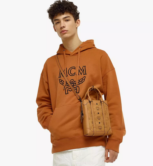 mẫu đeo túi MCM KLASSIK N/S SMALL CROSSBODY IN COGNAC VISETOS MMRBSBF04CO001