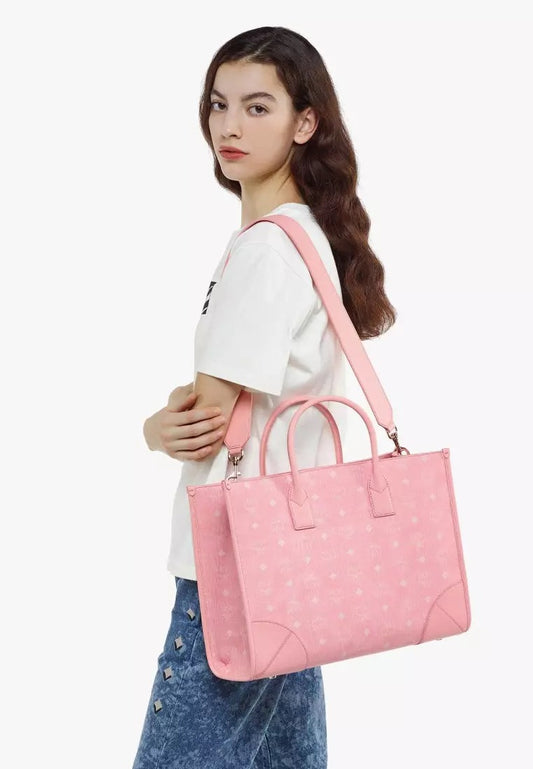 wearing MCM Large München Tote in Blossom Pink Visetos MWTCSBO02QZ001